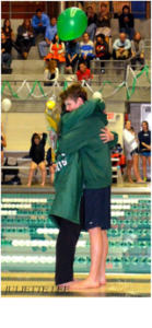 Smith and Hrabchak share an emotional moment at the team’s Senior Meet on February 8.